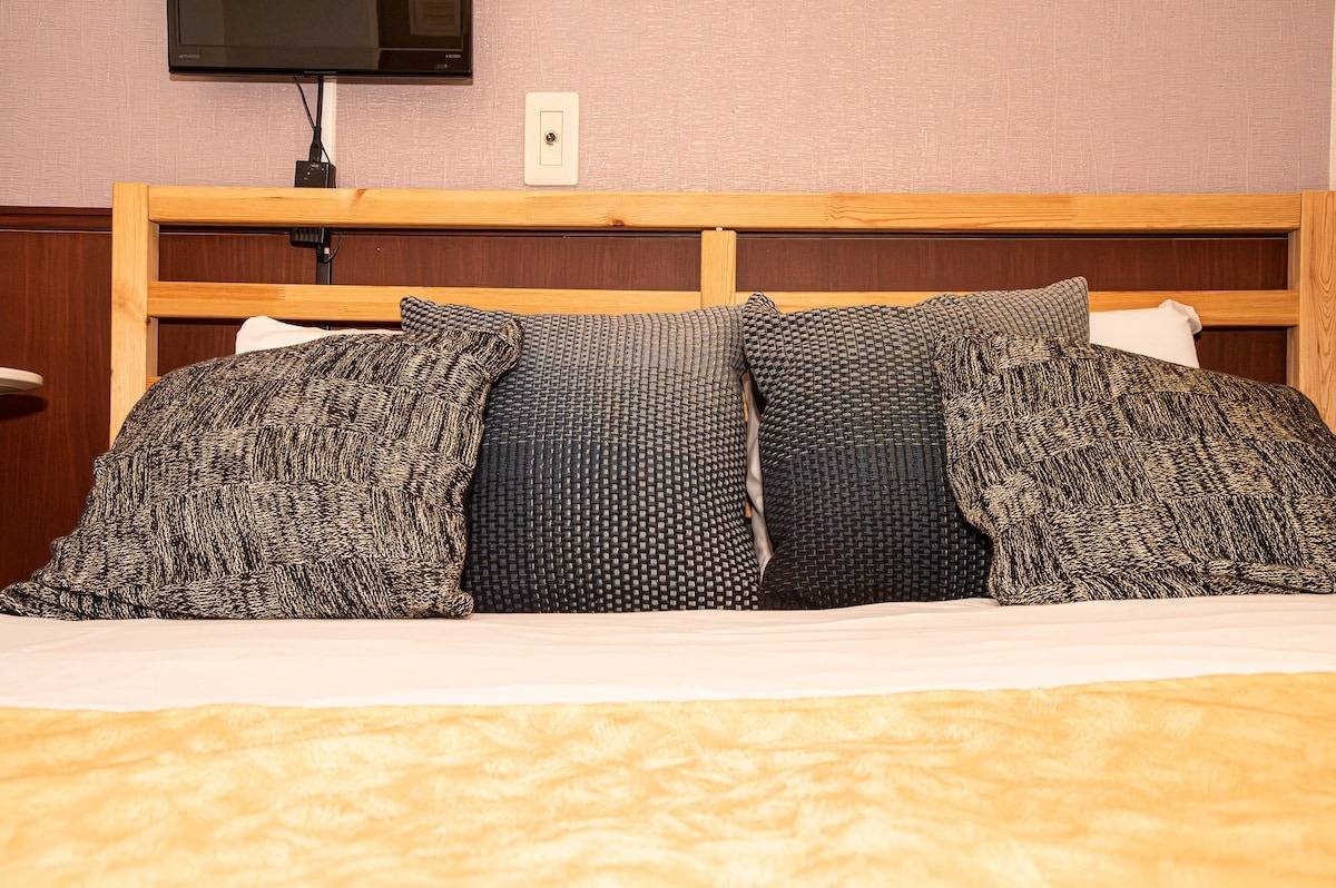 Wooden headboard with patterned cushions