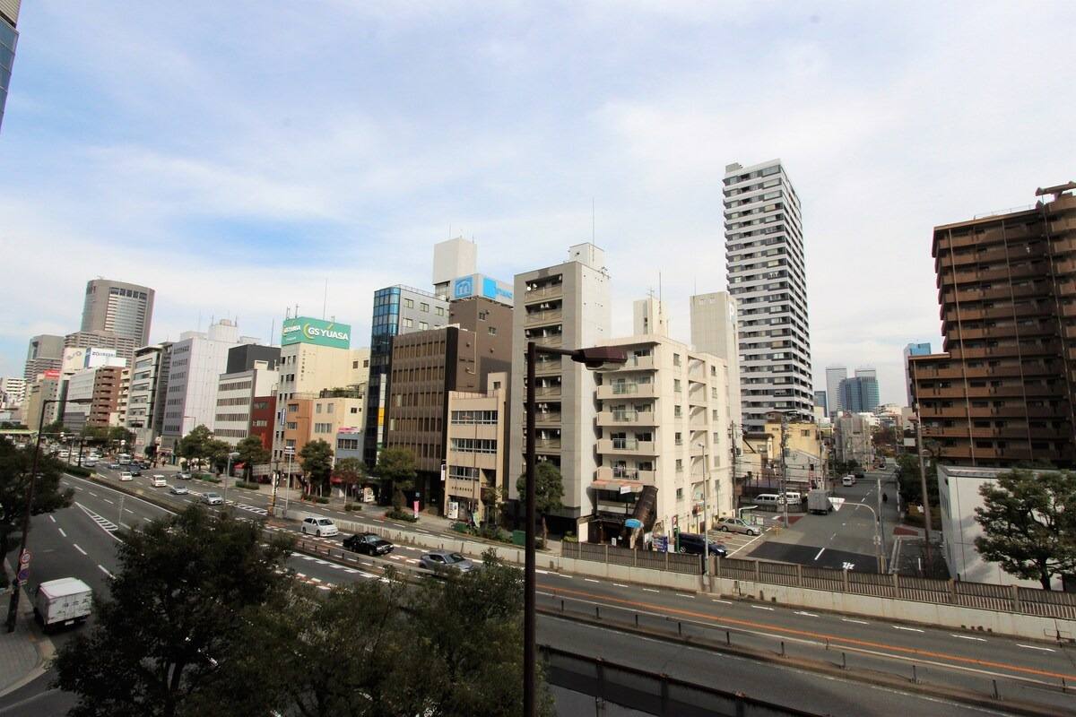 View over the street and the city from a guest room